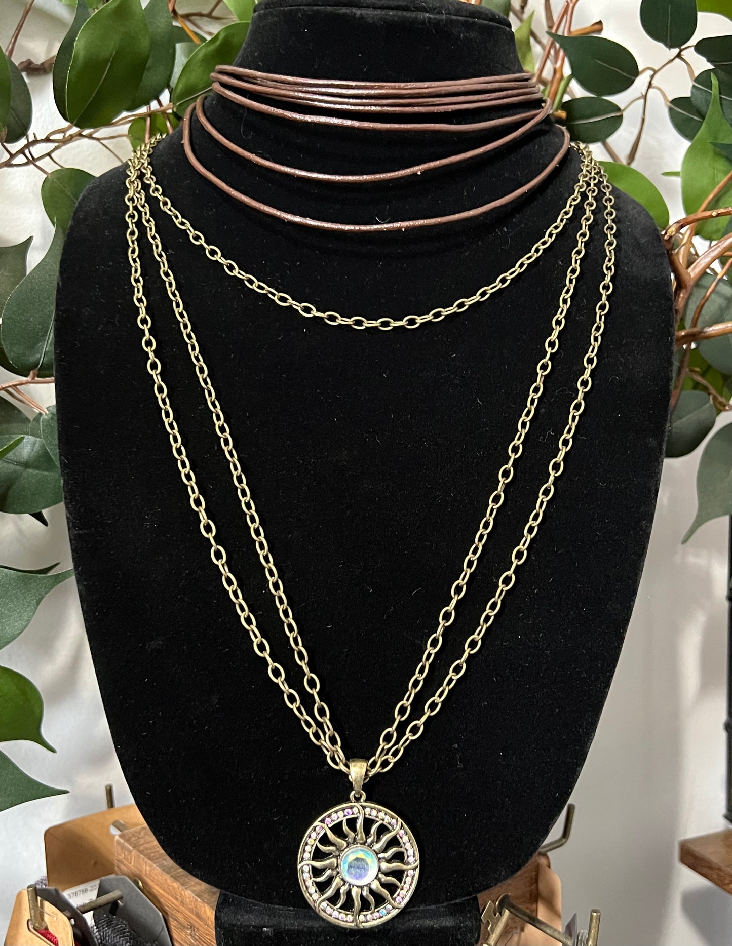 Gold Sun Necklace and Short Layered Leather